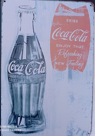 letrero de Coca-Cola en chapa.