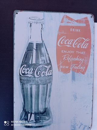 letrero de Coca-Cola en chapa.