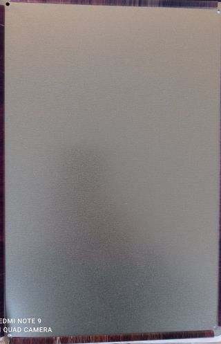 letrero de Coca-Cola en chapa.