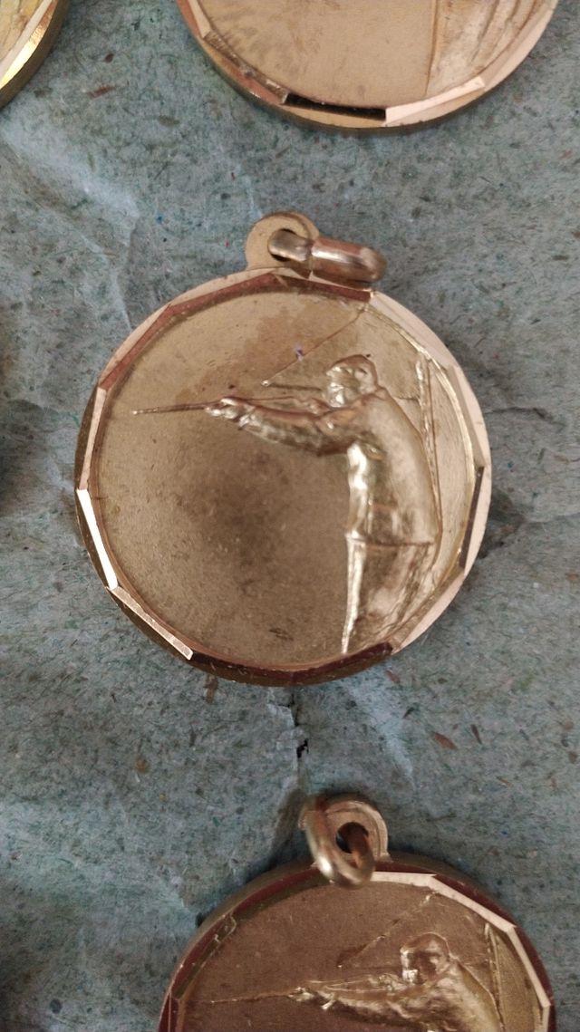 10 medaglie vintage tiro