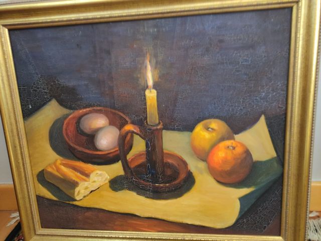 Marco dorado. Bodegón con vela encendida, pan, hue
