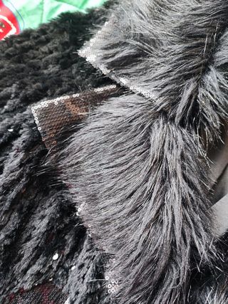 Chaqueta negra de pelo con brillo