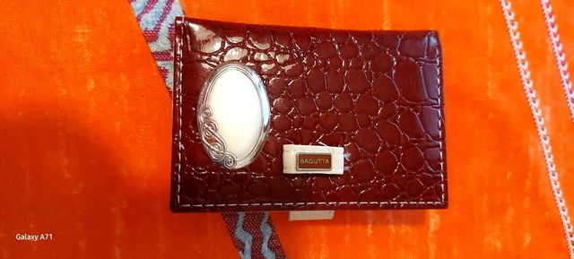 agendina da borsa in pelle e argento.