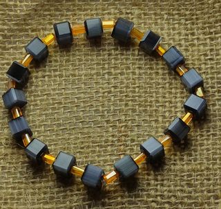 Pulsera elastica de ojo gato y cristal austriaco