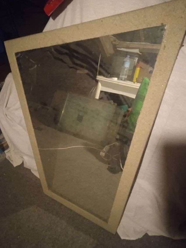 espejo con marco de arena