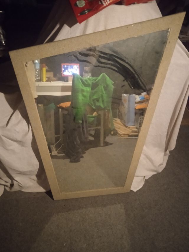 espejo con marco de arena