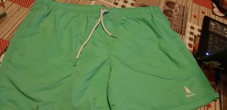 costume uomo verde con simbolo del cagnolino