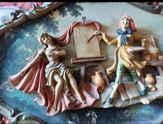 quadro con personaggi  in rilievo