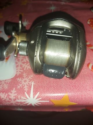 carrete casting shimano + 5 cañas de pesca.