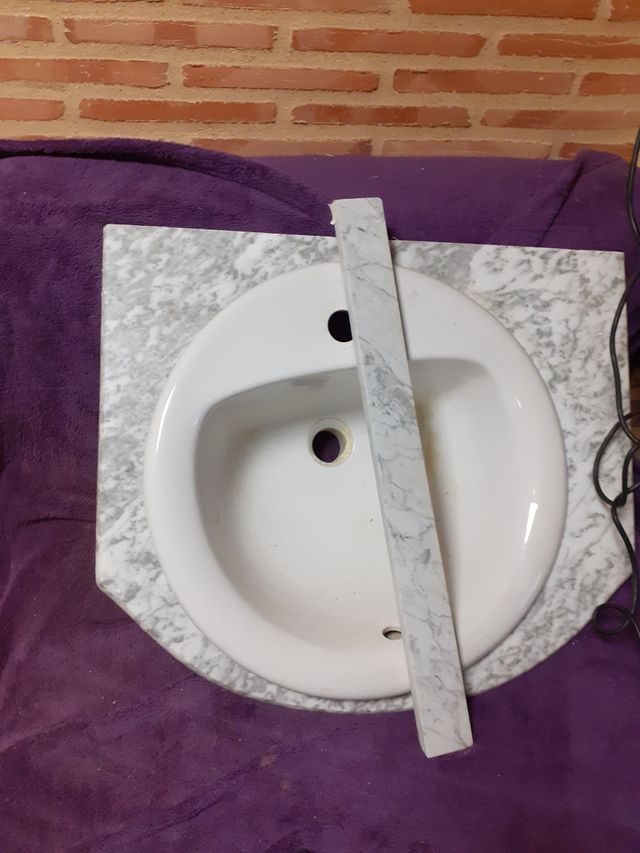 pica y piedra de marmol