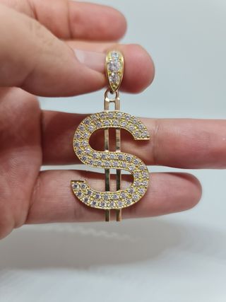Colgante símbolo del dólar en oro de 18 kilates