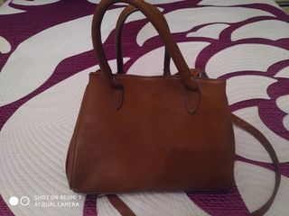 Bolsos , cartera y una mochila 