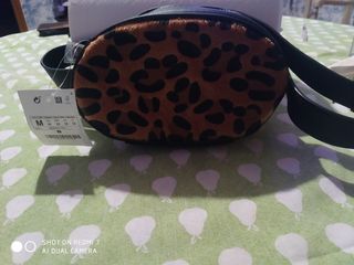 Bolsos , cartera y una mochila 