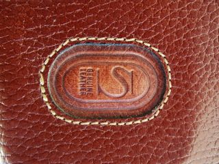 maletín o cartera de piel, para documentos.