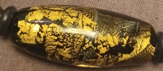 PULSERA EN ÓNIX CON PAPEL DE ORO.