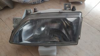 Faro delantero izquierdo FORD ESCORT 084311142L