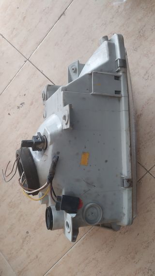 Faro delantero izquierdo FORD ESCORT 084311142L