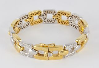 Pulsera en oro amarillo y blanco con brillantes
