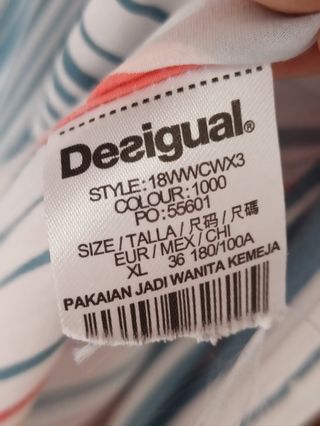 blusa Desigual blanca a tayas y estampada