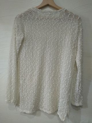 Jersey beig hilo dorado