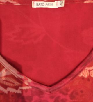 Camisola estampada en rojos Bató Peto, 42
Mangas 