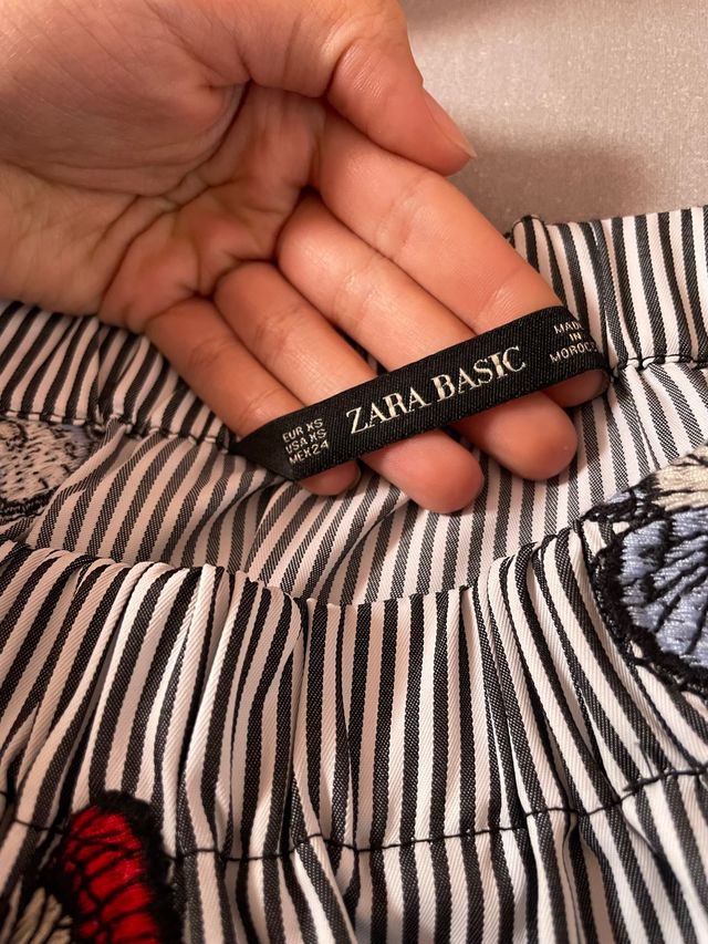 Blusa a rayas con mariposas