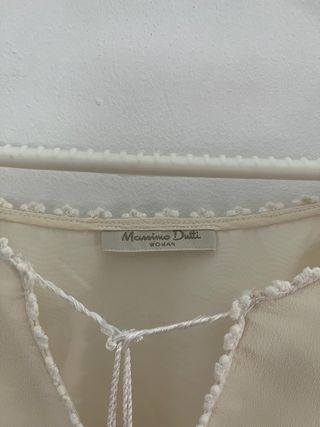 Blusa semitransparente cruda con borlas