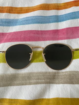 Gafas rayban round metal doradas
