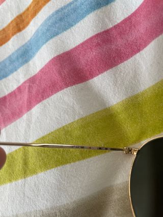 Gafas rayban round metal doradas