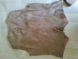 Gilet, pantaloni e cappotto firmati Synthesis