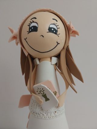 Muñeca fofucha de comunión. 