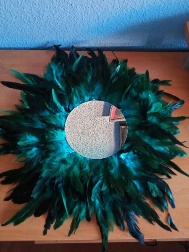 Jujuhat espejo plumas