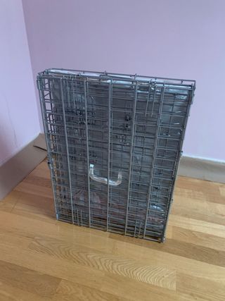 Transportin metal plegable.