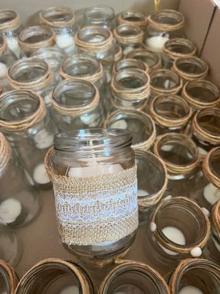 50 botes de cristal con velas decorados