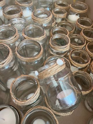 50 botes de cristal con velas decorados