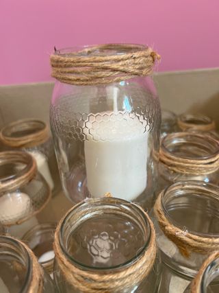 50 botes de cristal con velas decorados