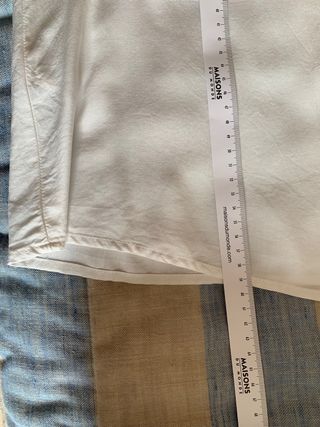 Camisa blanca sin mangas, de Mango, talla S.