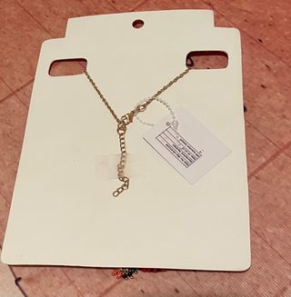 Colgante de hilo y abalorios