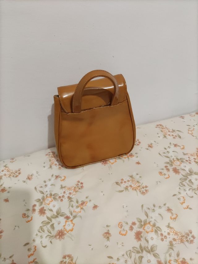 Mochila de mão da marca Paloma Picasso