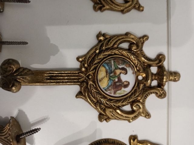 juego de percheros de bronce