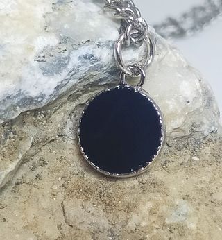 Pequeño colgante de hombre. Acero inoxidable.