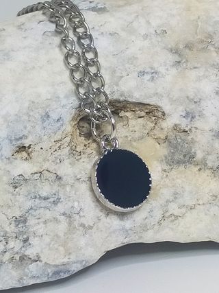 Pequeño colgante de hombre. Acero inoxidable.