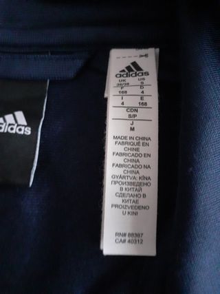 chaqueta de chándal impecable,
