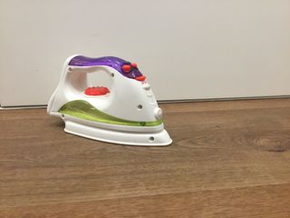 Plancha con tabla de planchar