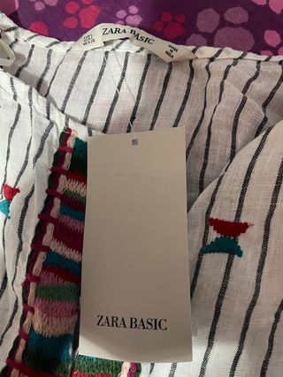 Camisa rayas con bordados y borlas