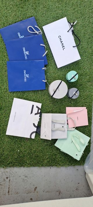 Lote bolsas y cajas de marca Swarovski Tous