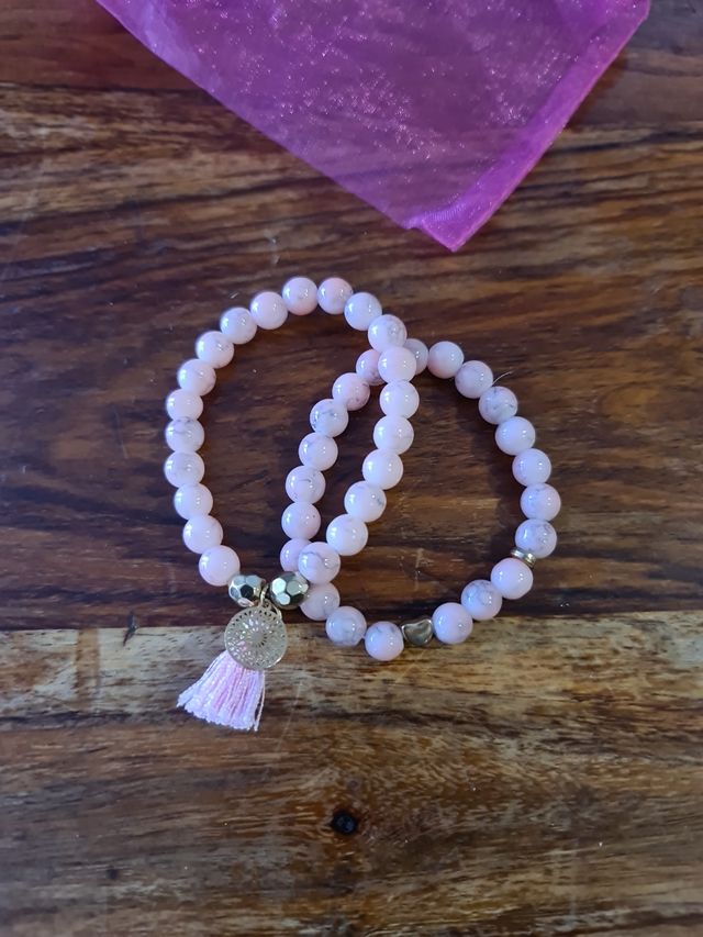 Juego de 2 pulseras rosas con detalles