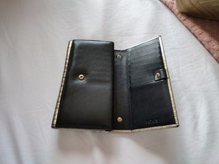 cartera Tous piel negra y dorada 