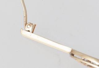 Broche antiguo en oro amarillo 18k y brillantes