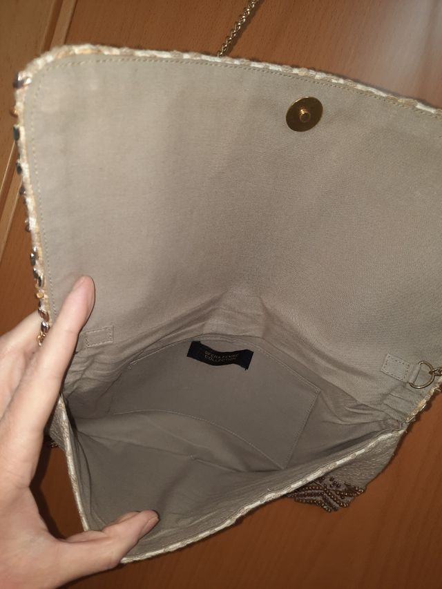 bolso blanco y dorado sfera a estrenar